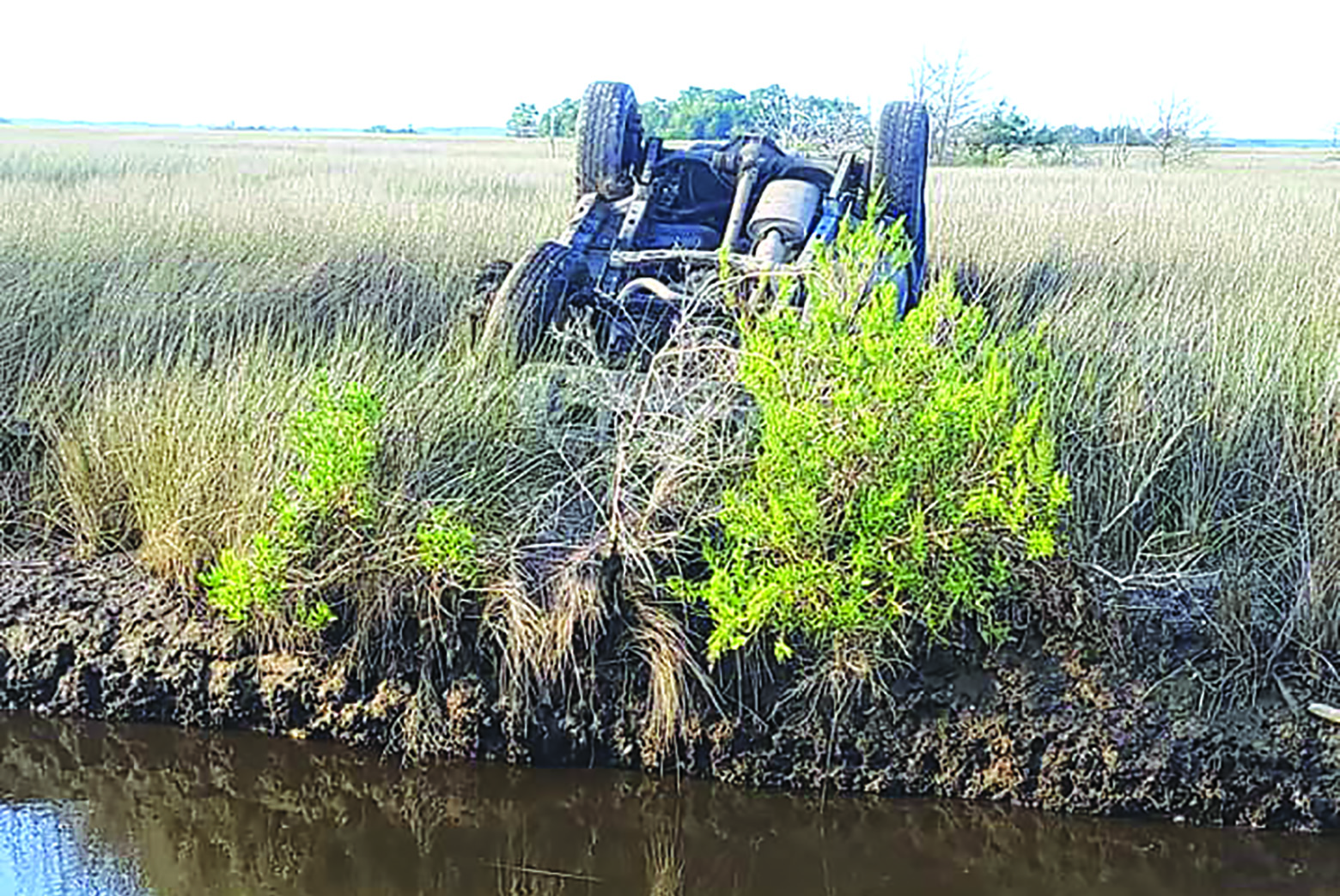 Driver, Passenger Uninjured After Vehicle Flips Into Marsh Near Guard Shore