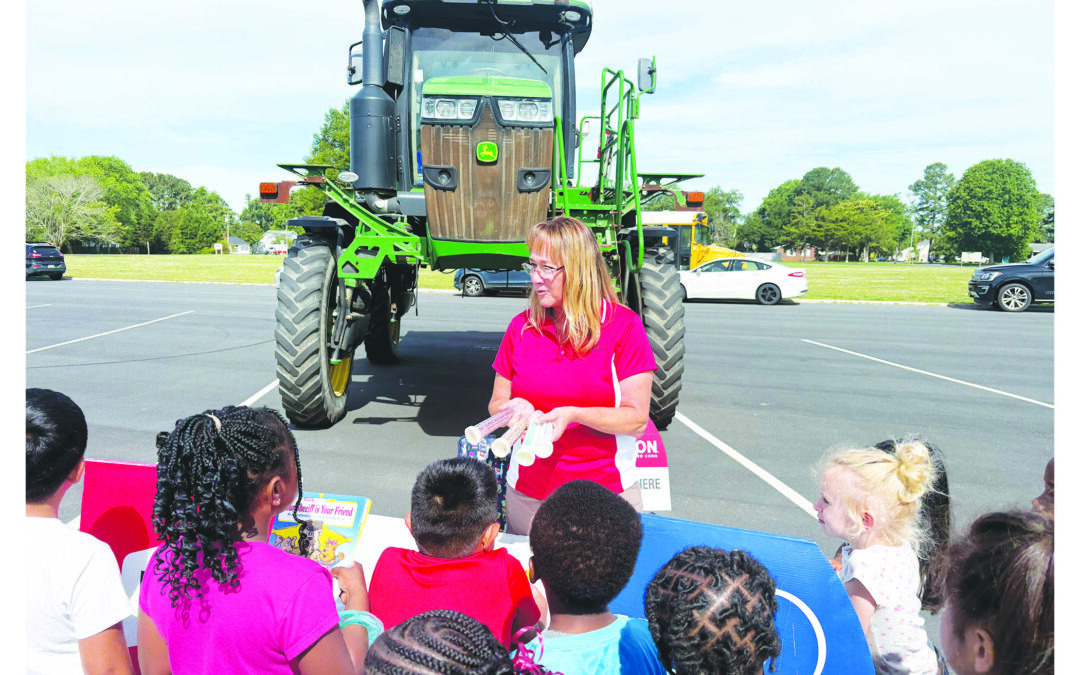 With fertilizer machine, Luttig shows the field is a field for women